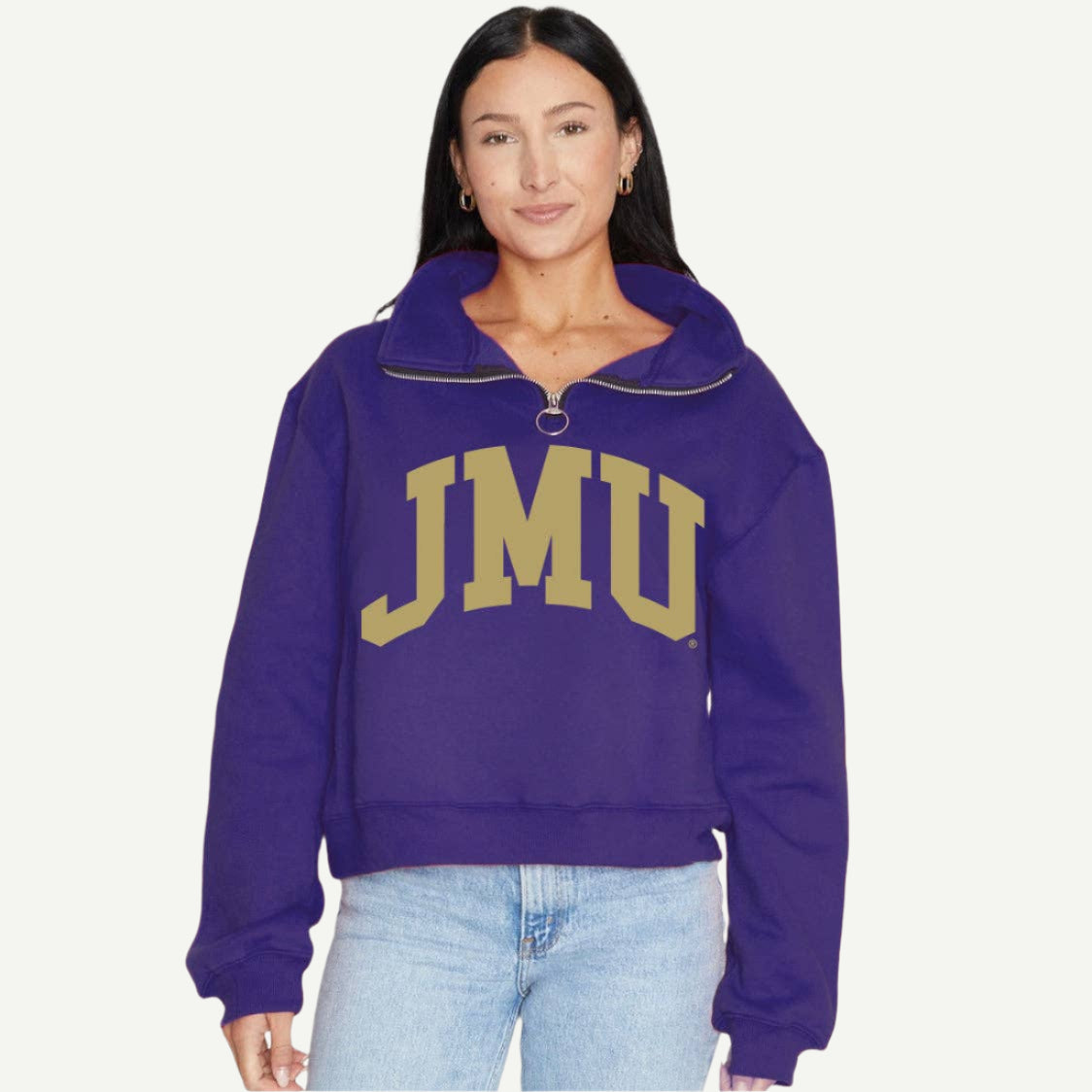 Person wearing a purple hoodie with 'JMU' on a white background