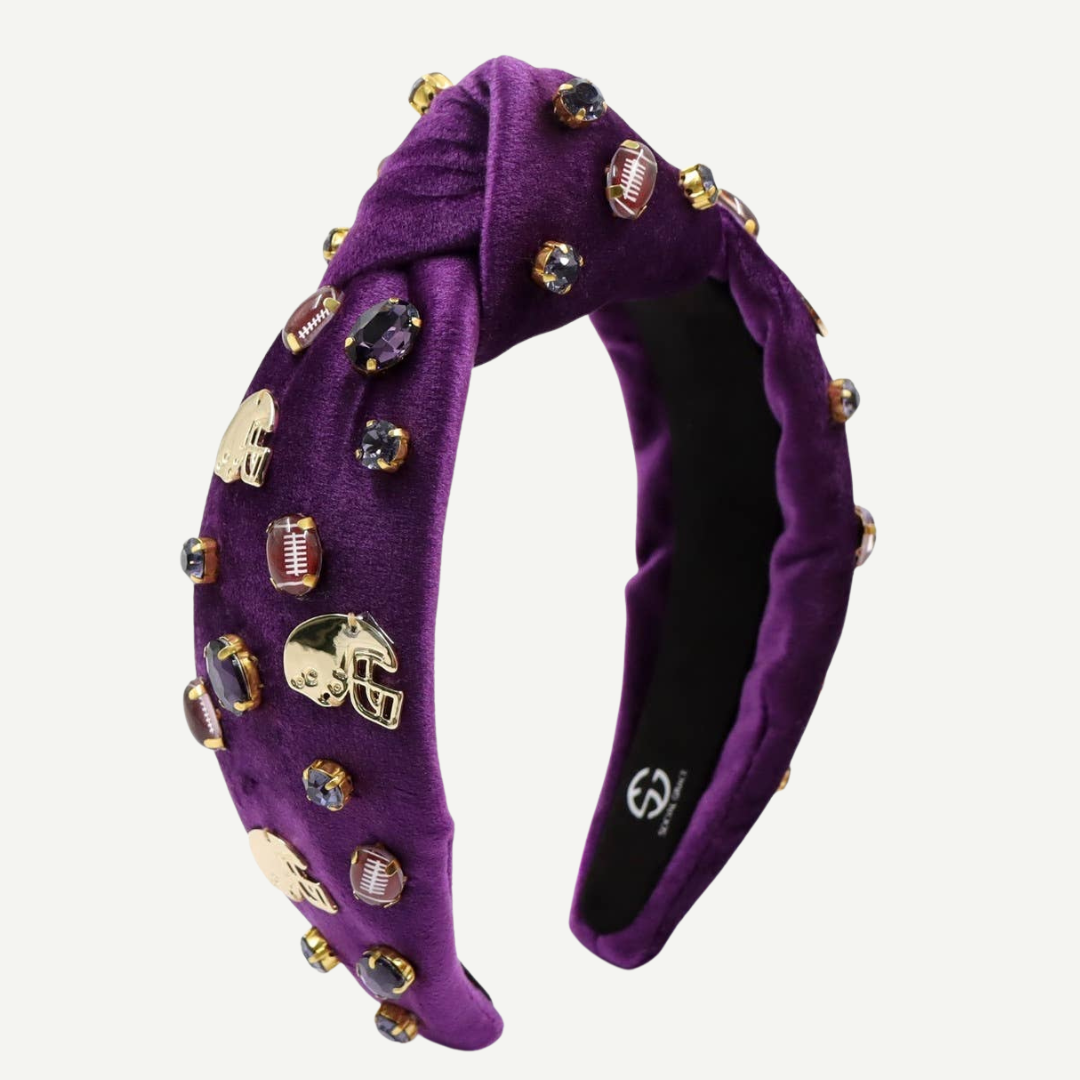 Purple headband with decorative elements on a white background