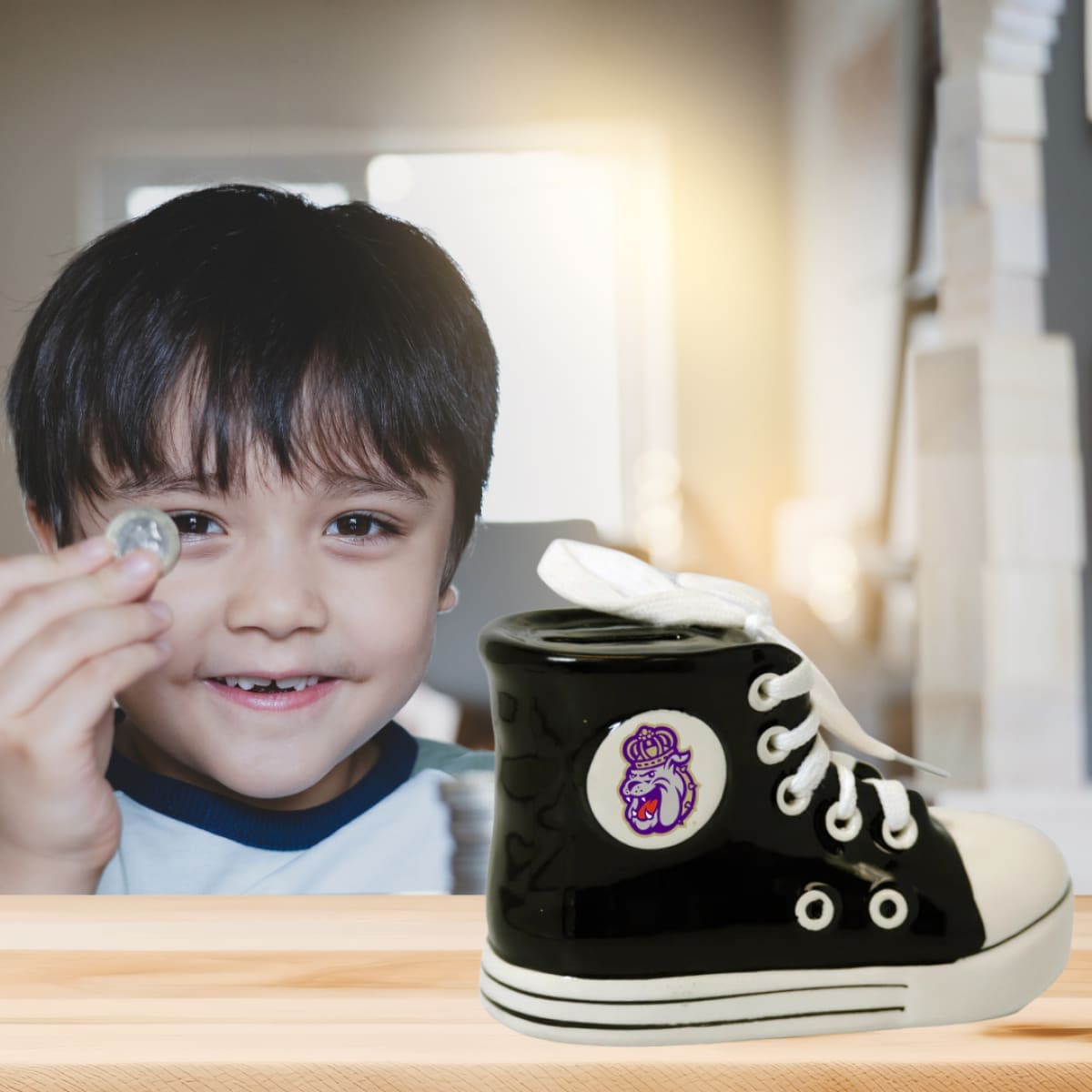 KID PUTS HIS COIN ON JMU SHOE BANK