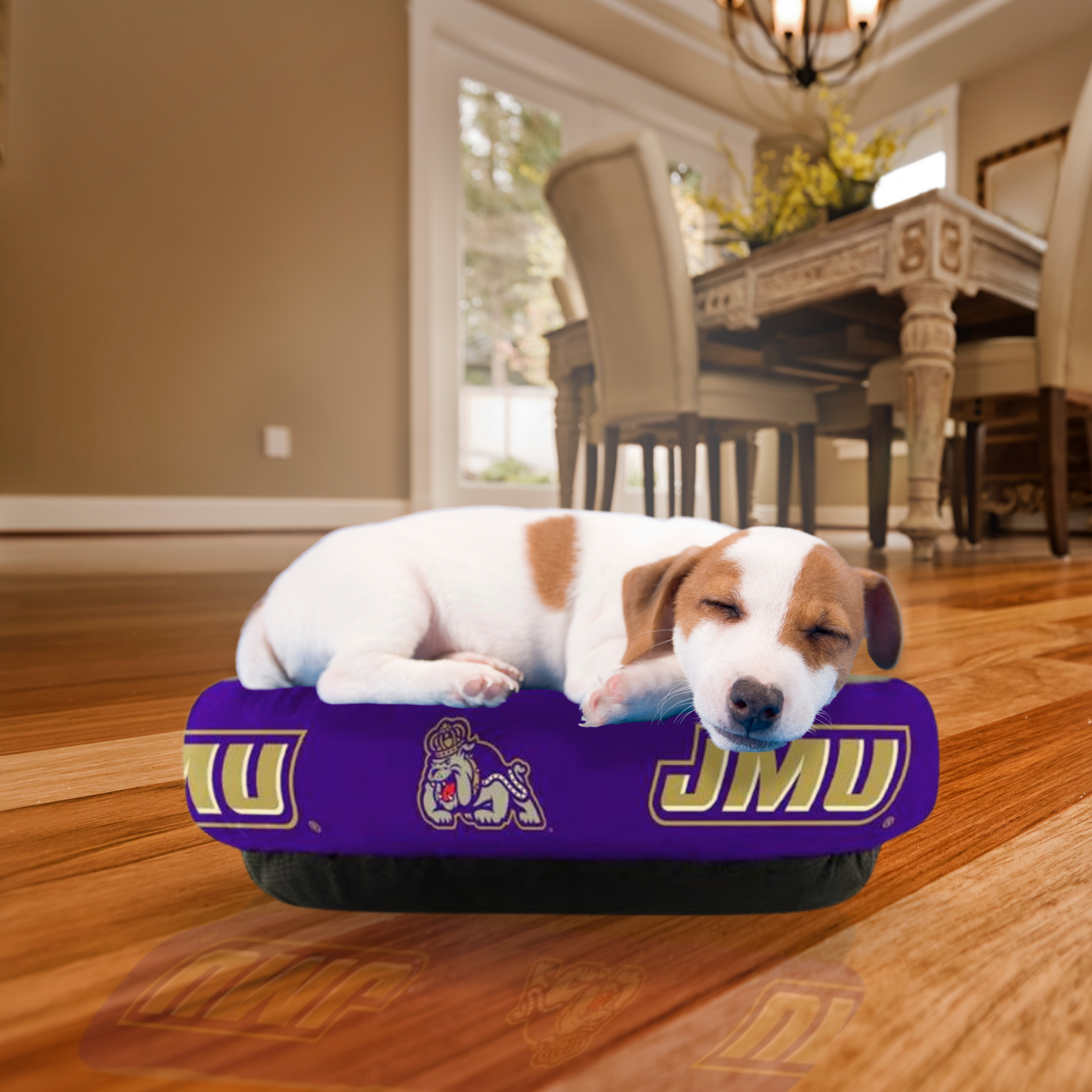 James Madison Dukes Plush Donut Dog Bed with JMU logos and non-slip bottom, providing comfort and style for pets.