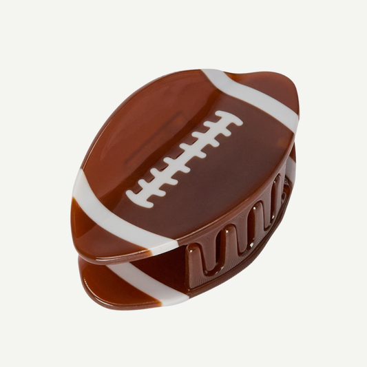 Chocolate candy shaped like a football on a white background