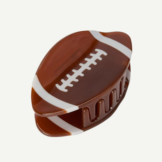 Chocolate candy shaped like a football on a white background