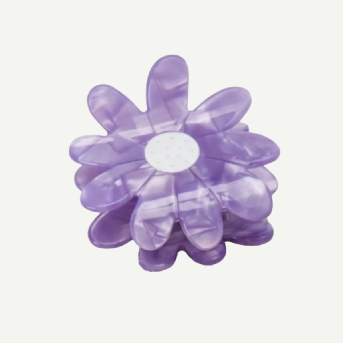 Purple flower-shaped object on a white background