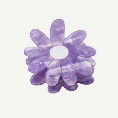 Purple flower-shaped object on a white background
