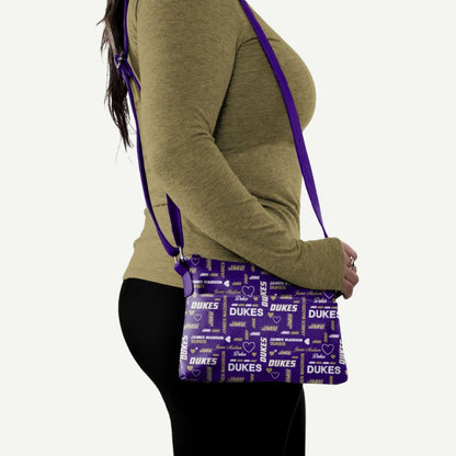 JMU merchandise – James Madison Dukes Logo Love Crossbody Purse with heart and logo pattern, silver zipper, and adjustable strap