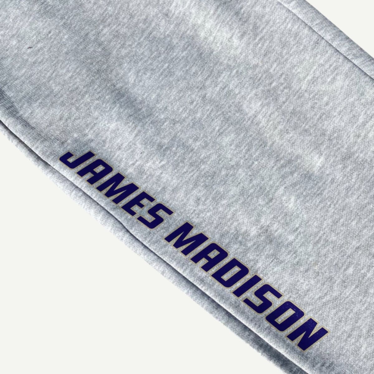JMU Basic Sweats – Gray fleece sweatpants with an elastic waistband and side pockets, featuring the JMU logo. Perfect for lounging or game day.  