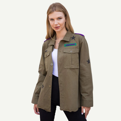 Model wearing the JMU Bling Shacket, an olive-green cotton jacket with crystal Duke Dog details and black star accents.