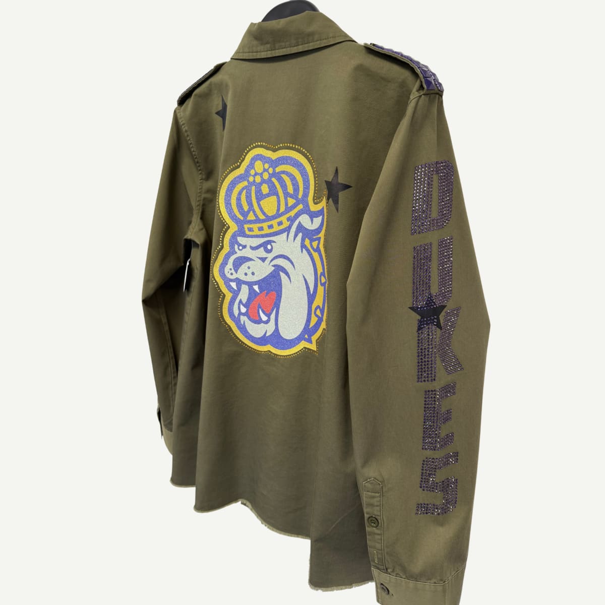 Back view of the JMU Bling Shacket, showcasing unique embellishments and a bold JMU design.
