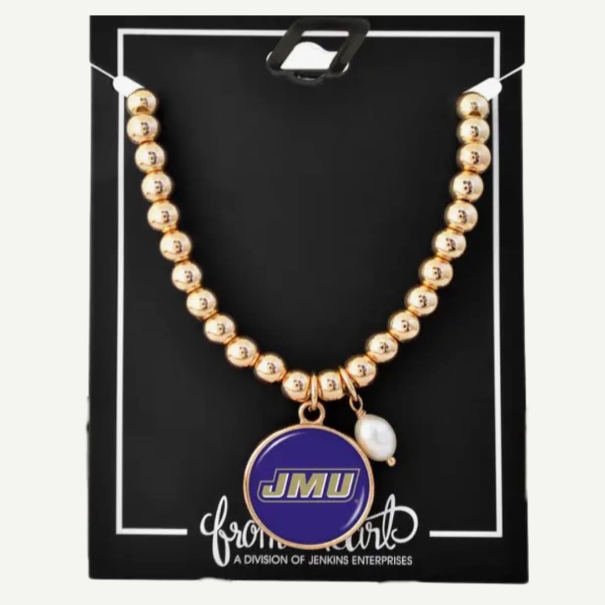 Gold beaded necklace with a JMU pendant on a black card