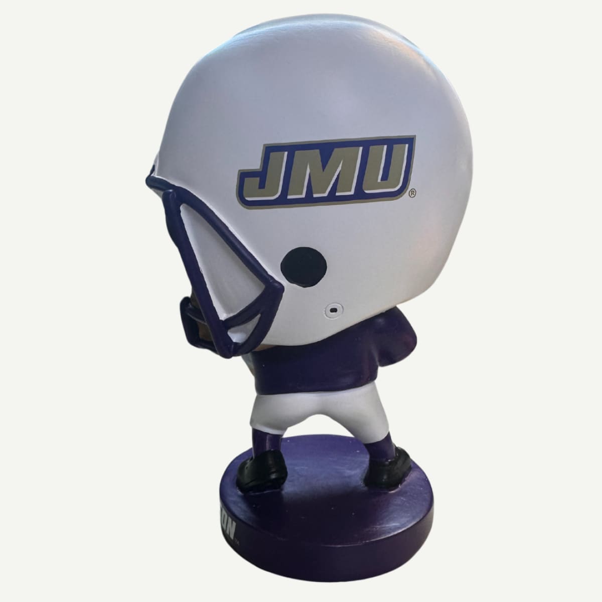 Side view of the JMU Lil Big Head Mascot Garden Statue, showcasing its hand-painted details and printed team logo.