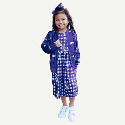 Young girl wearing a purple jacket and checkered dress on a white background