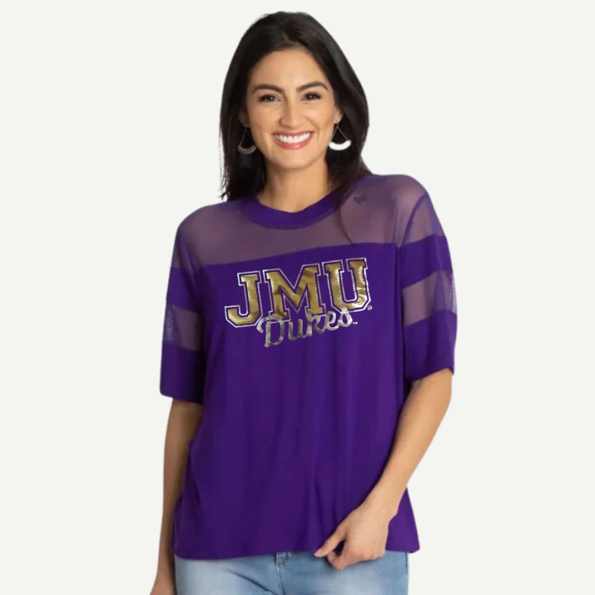 Woman wearing a purple 'JMU Dukes' shirt on a white background